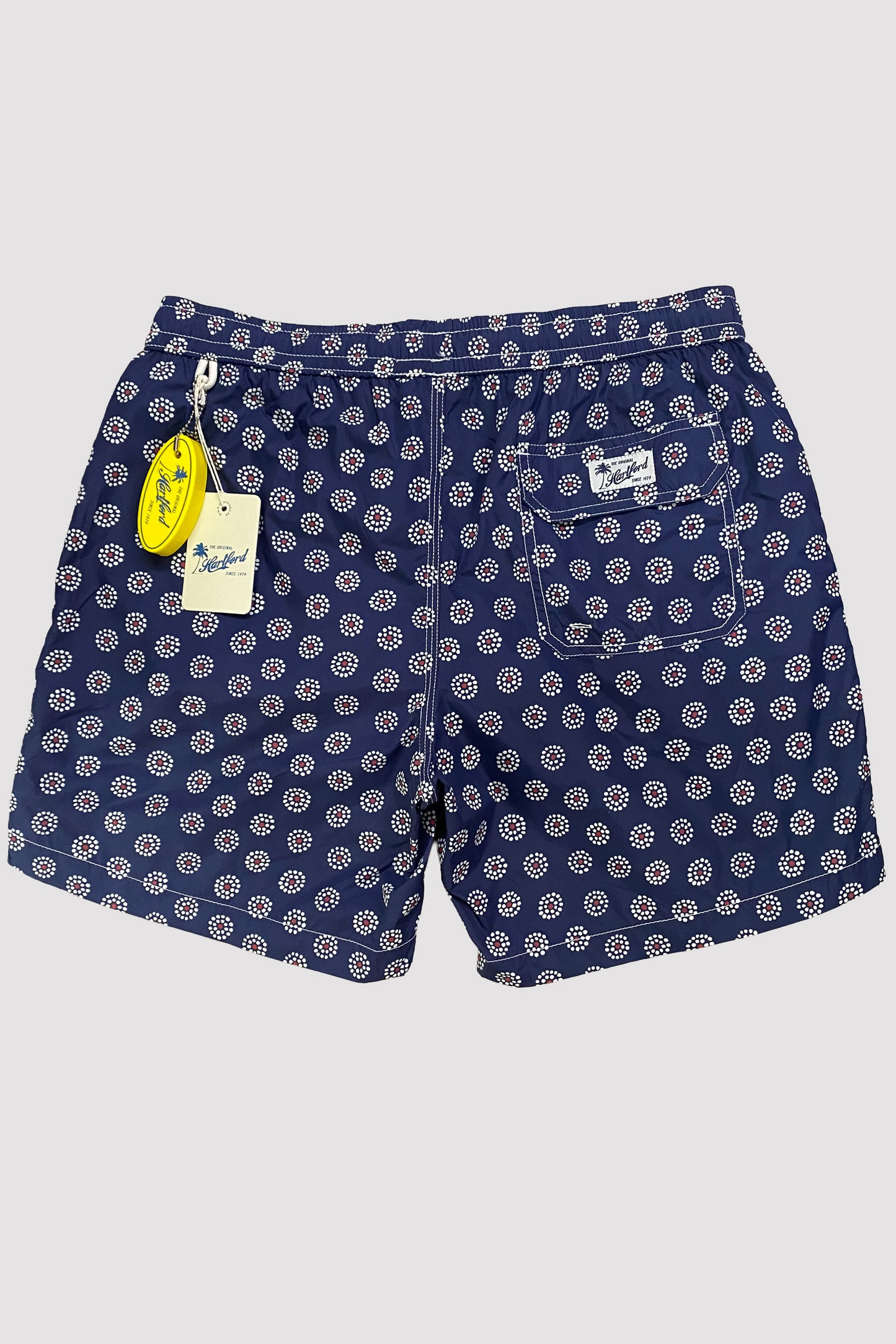 HARTFORD TRAJE DE BAÑO NAVY CON FLORES BLANCAS Y CENTRO ROJO